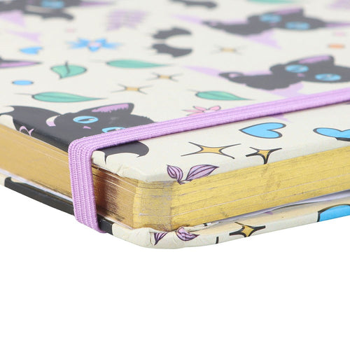 Notebook with a colorful cat pattern on the cover and gold edging