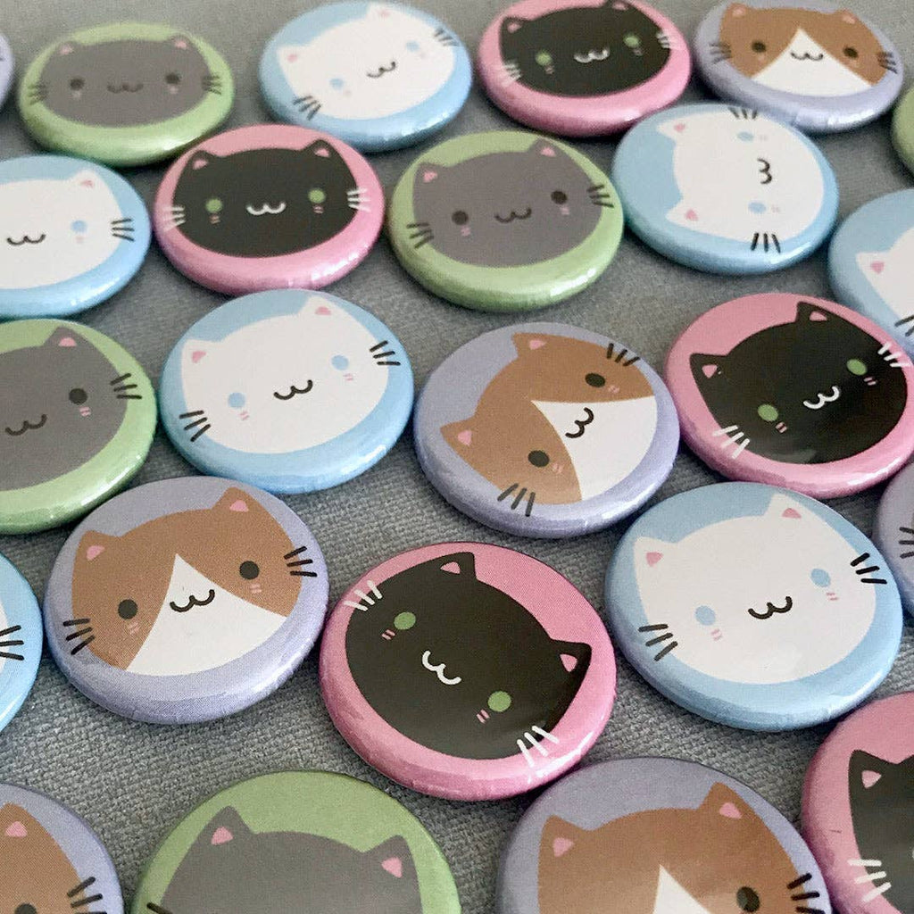 Lots of cat badges in lots of colours