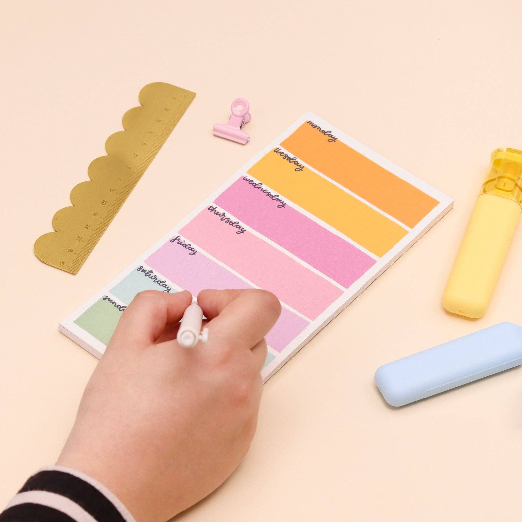 Colorful weekly planner on a beige background